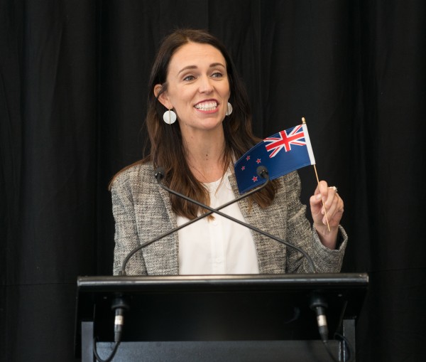 The Prime Minister, Rt Hon Jacinda Ardern, presents a flag to be placed in the b